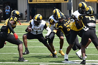 Wide receiver Daemon Dawkins (1) finds a hole to run through during UAPB's Black and Gold Spring Game on Saturday at Simmons Bank Field in Pine Bluff. (Pine Bluff Commercial/I.C. Murrell)